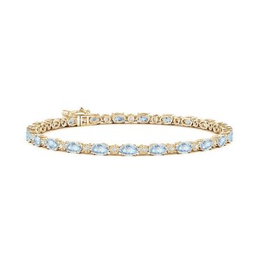 Oval Aquamarine Tennis 14 KT Yellow Gold Bracelet with Gypsy Diamonds